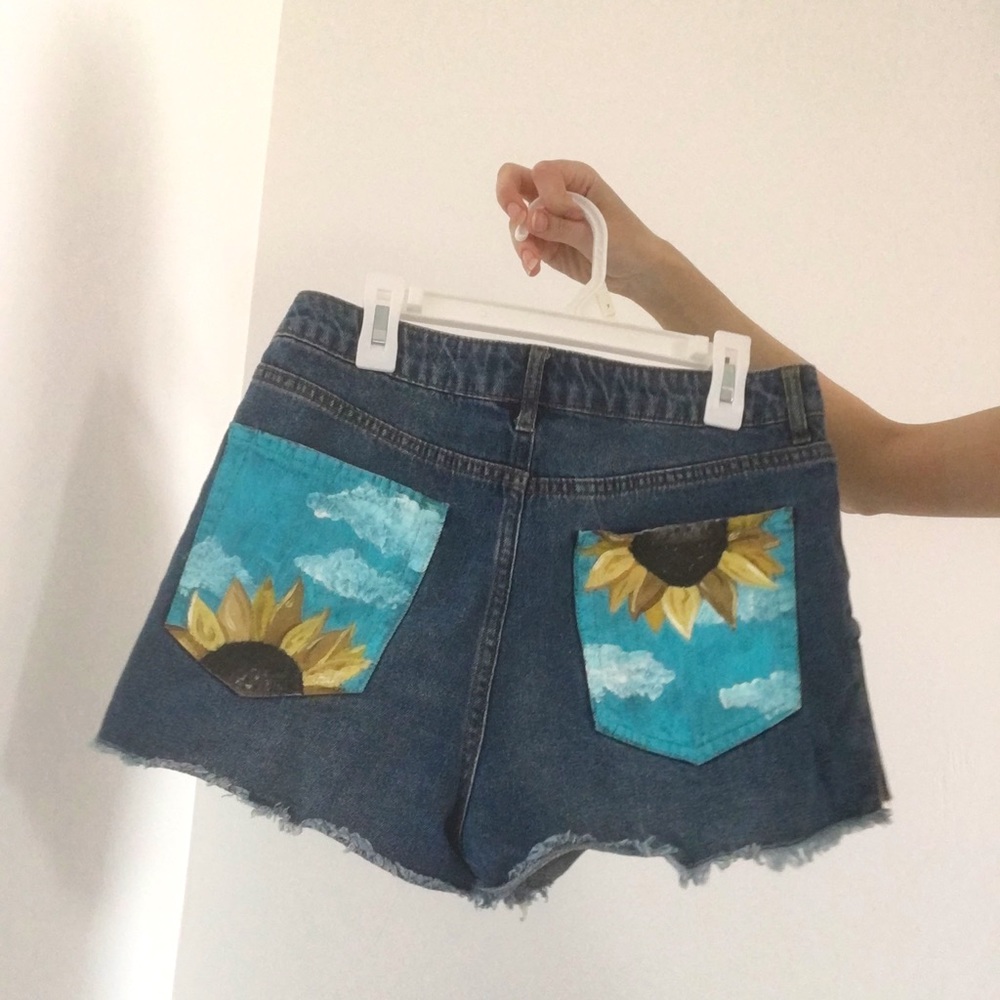Denim shorts with sunflower painted pockets
